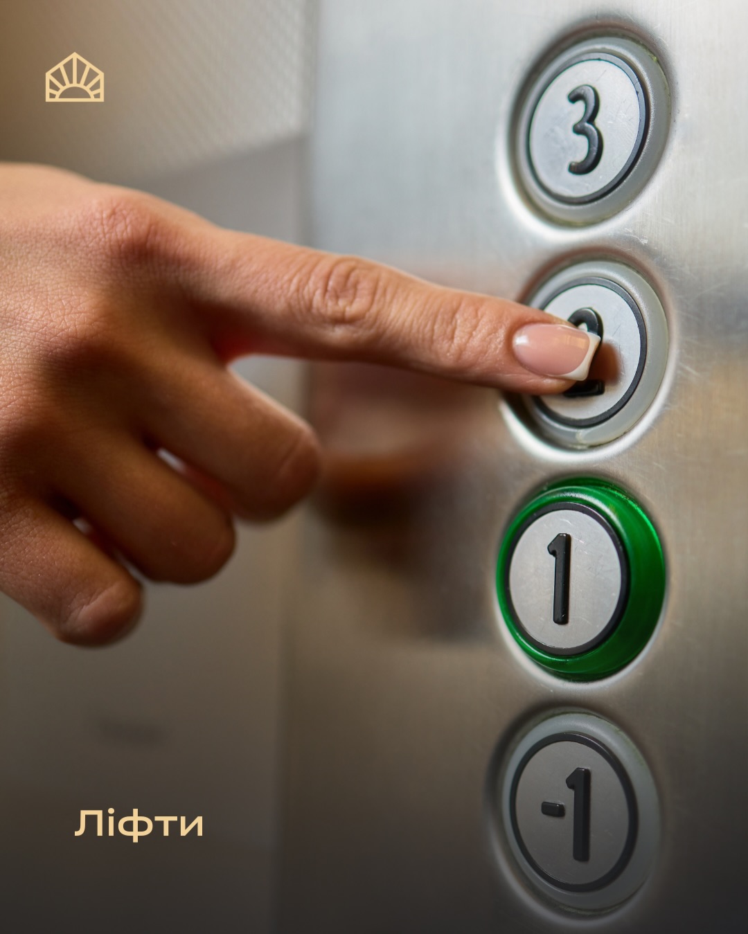 Close-up of a hand pressing the elevator floor button; the green illuminated '1' button is visible, with a '3' button above.