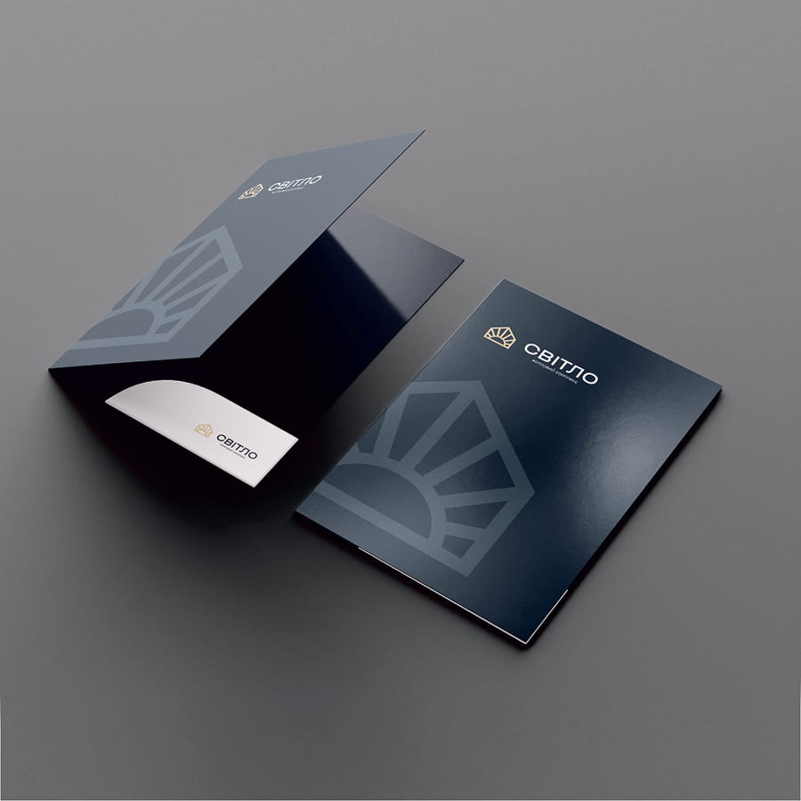 Dark blue business card and booklet mockup with a gold CBITTO logo and geometric watermark, one card slightly lifted revealing a white substitute card.