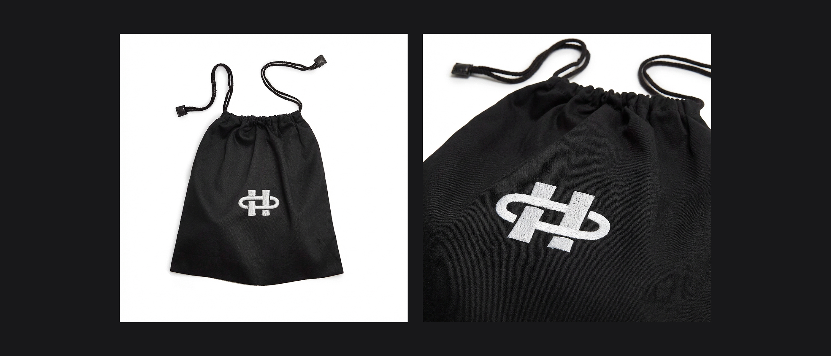 Black drawstring pouch with white embroidered logo on the front, shown against a white background (full view).